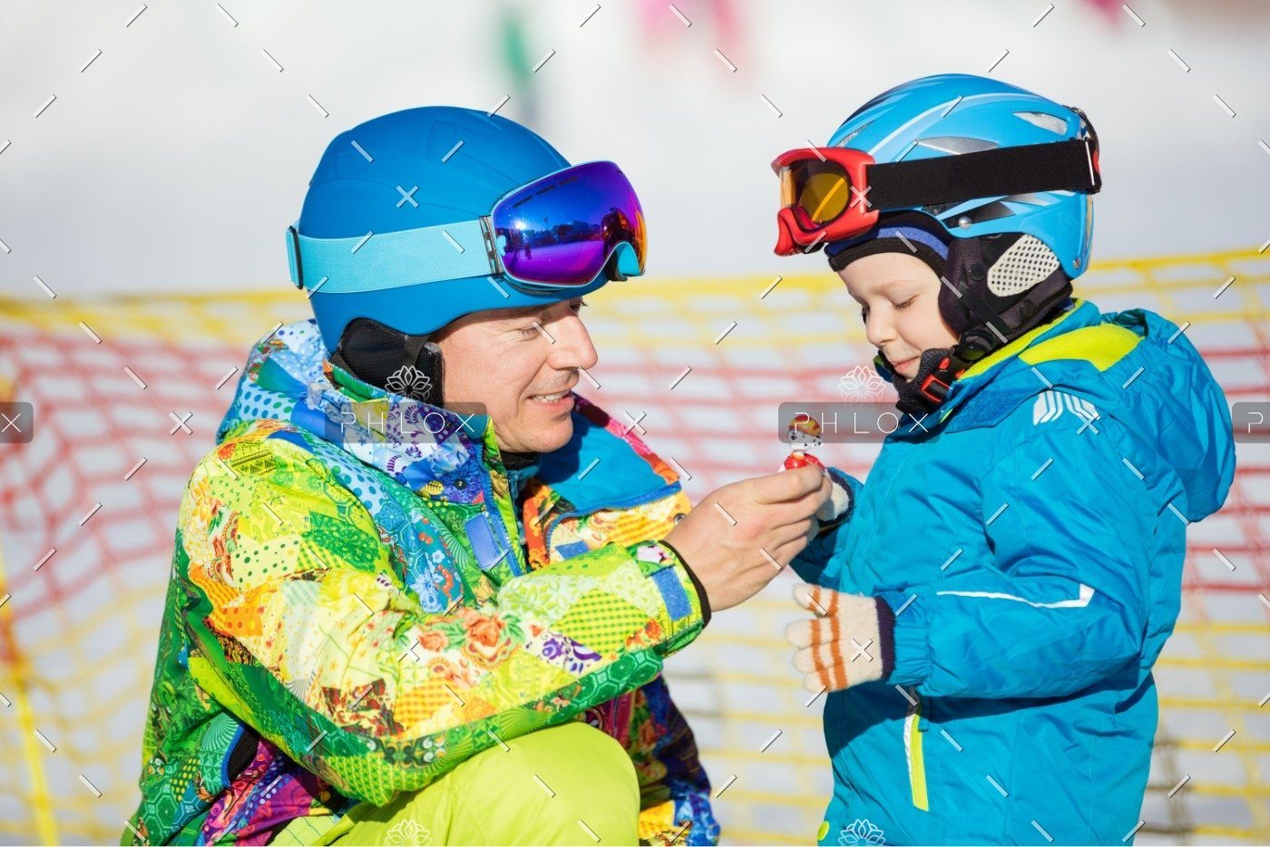 demo-attachment-148-father-and-little-son-in-skiing-outfits-playing-PMSY642
